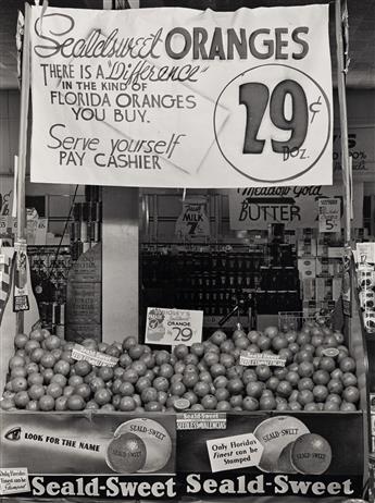 (ADVERTISING & STORE WINDOWS--FRUIT) A collection of 27 advertising and display photographs related to the Florida orange and citrus in